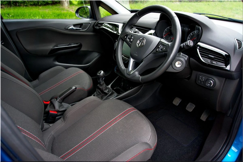 Modern electric car interior with comfortable seating and climate controls